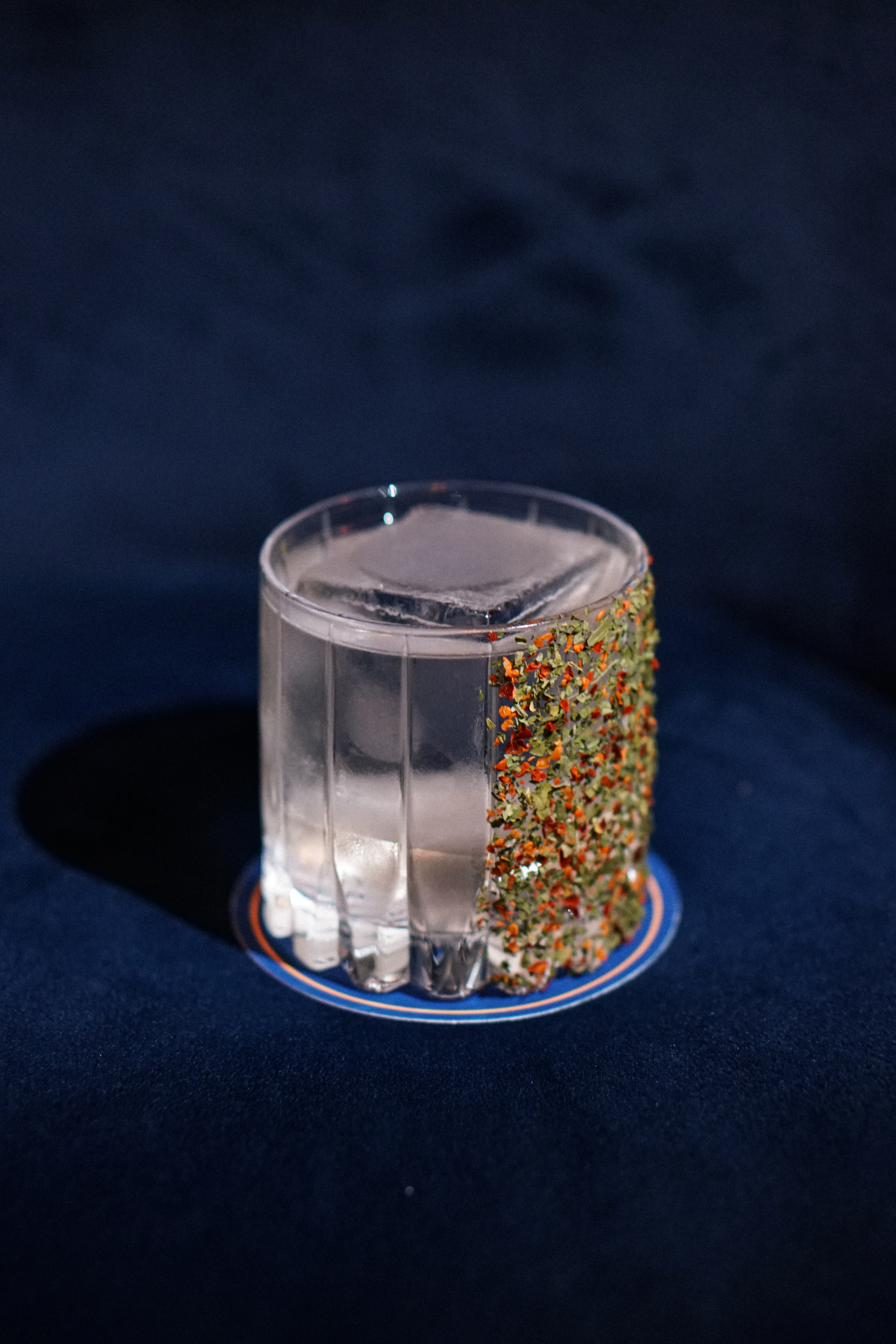 Margarita-style cocktail with herb and chili rim